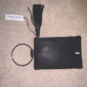 Thacker hand held purse new 100% genuine leather.